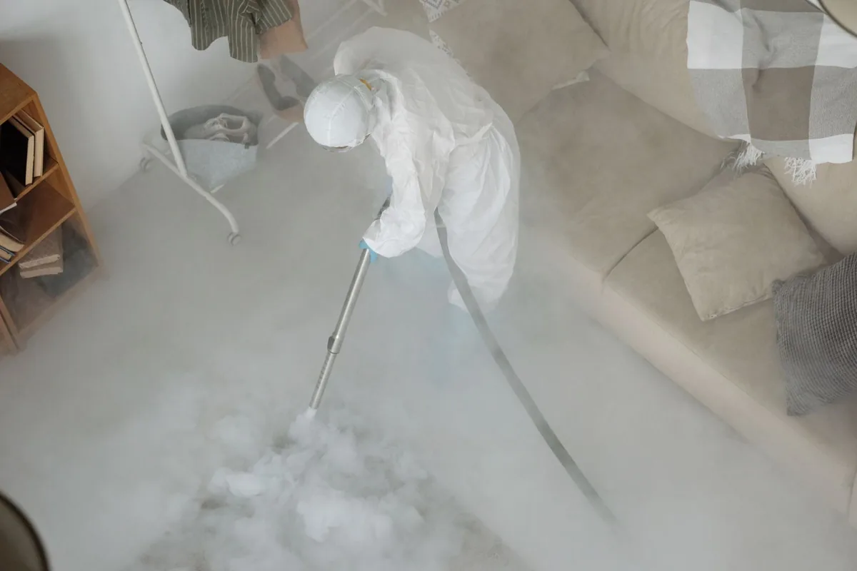 Biohazard cleanup technician in protective equipment, Eldorado at Santa Fe, NM